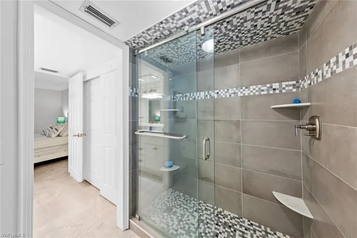 Bathroom with a shower with door