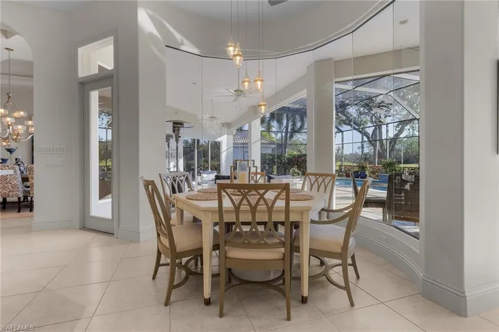 Tiled dining area with a notable chandelier