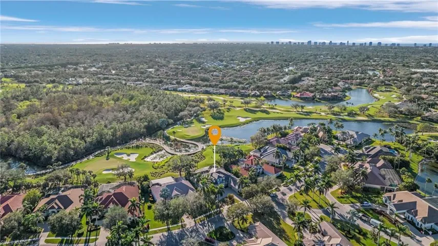 Birds eye view of property with a water view