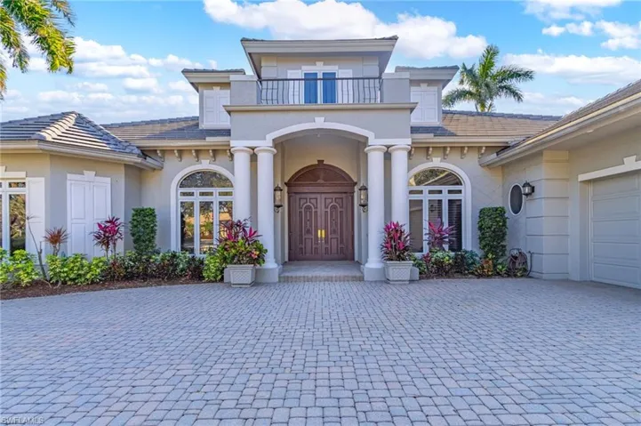 View of front of property featuring a balcony