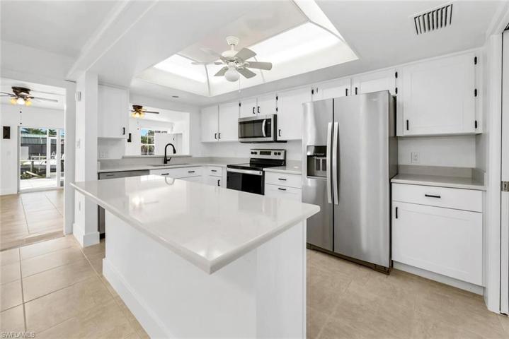 Quartz Counter Tops New Appliances New White Cabinets with Wine Rack