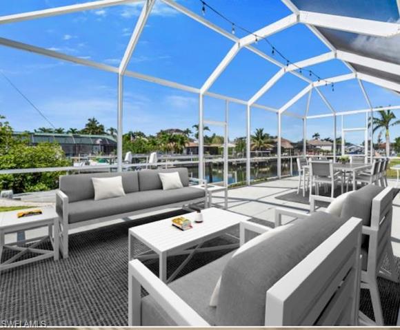 Virtually Staged Lanai overlooking Boat Lift and Canal