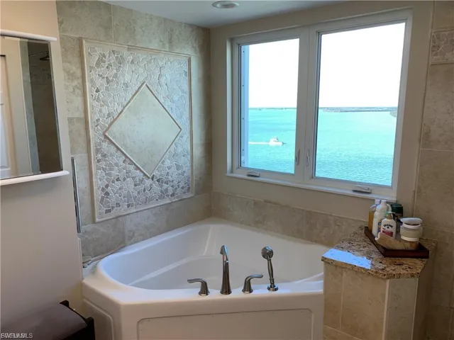 Full bath featuring a garden tub