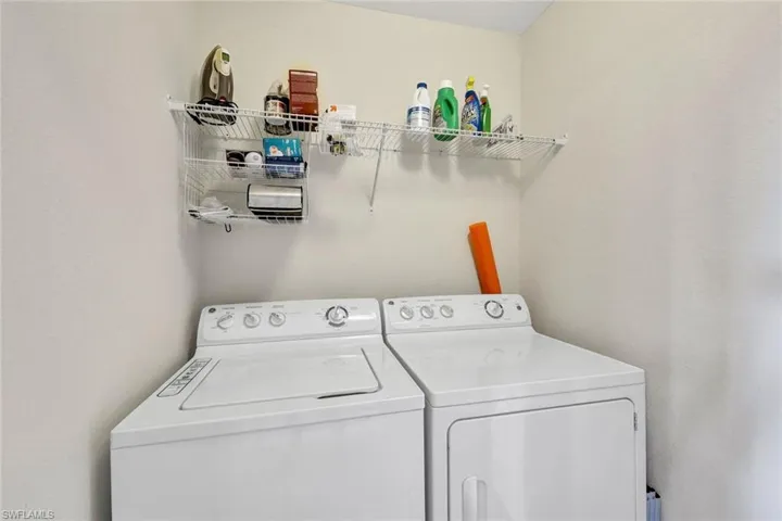 Washroom featuring independent washer and dryer