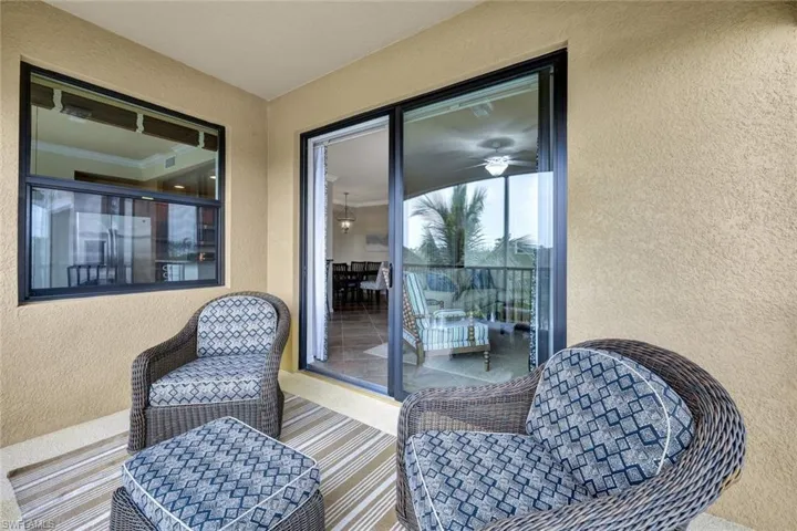 Balcony featuring a sunroom