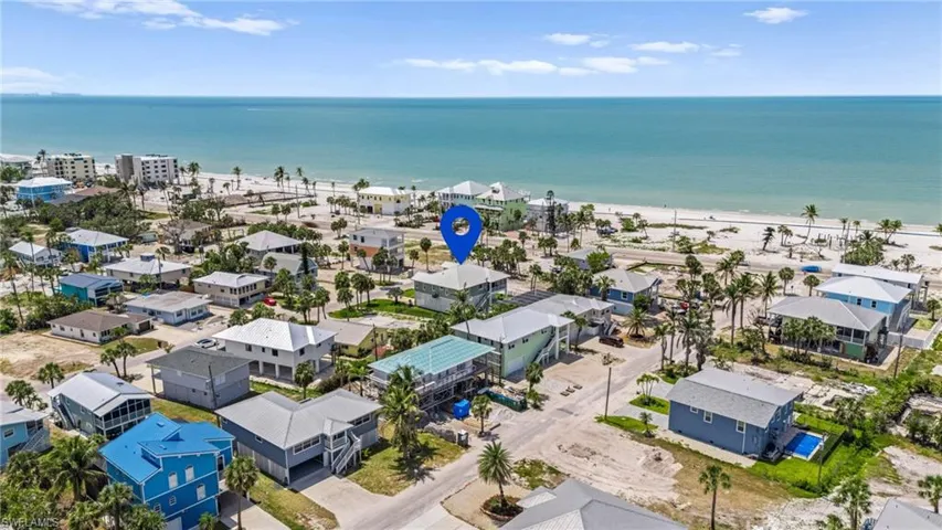 West Beach View - Birds eye view of property featuring a view of the beach, a water view, and a residential view - VIRTUAL EDITED EXTERIOR IMAGE