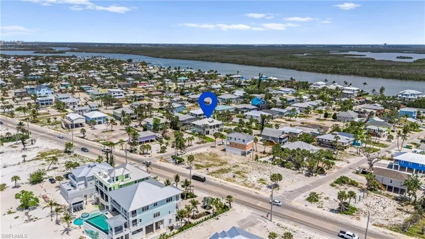 Bird's eye view with a water view and a residential view - VIRTUAL EDITED EXTERIOR IMAGE