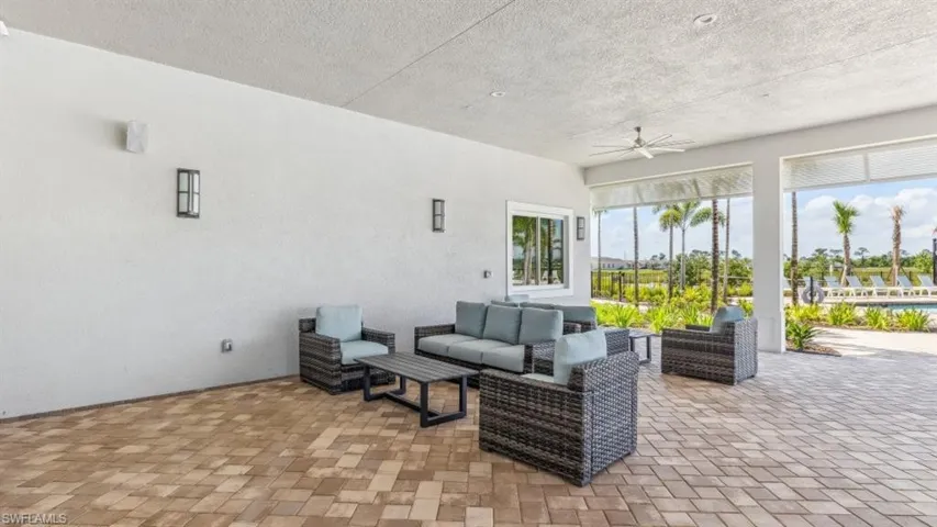 View of patio / terrace with ceiling fan and an outdoor living space
