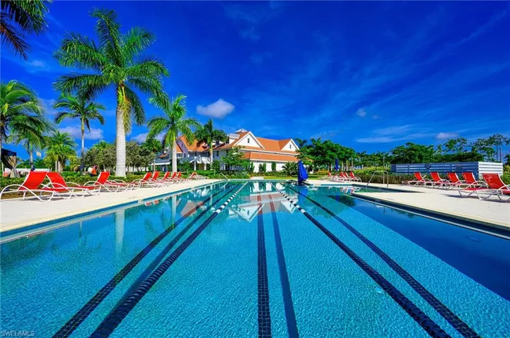 Community pool with a patio