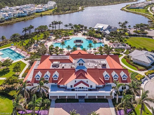 Bird's eye view of a pool and a nearby body of water