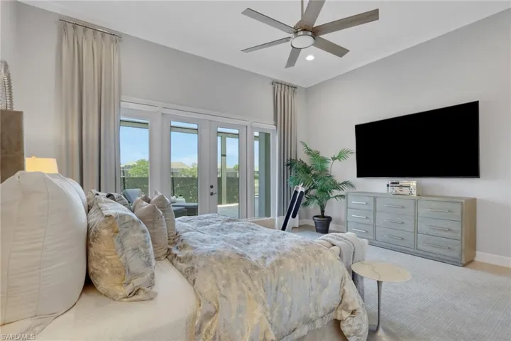 Carpeted bedroom featuring french doors, access to outside, a ceiling fan, and recessed lighting