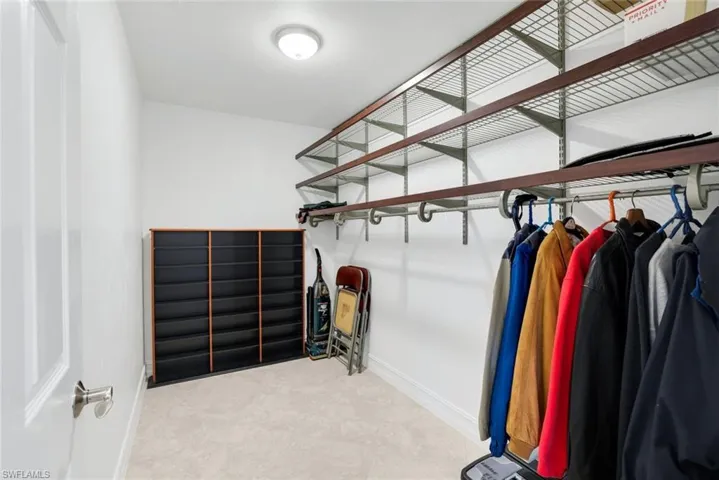 View of one of two walk-in closets.