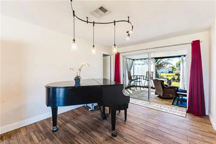 Living area featuring wood finished floors and baseboards