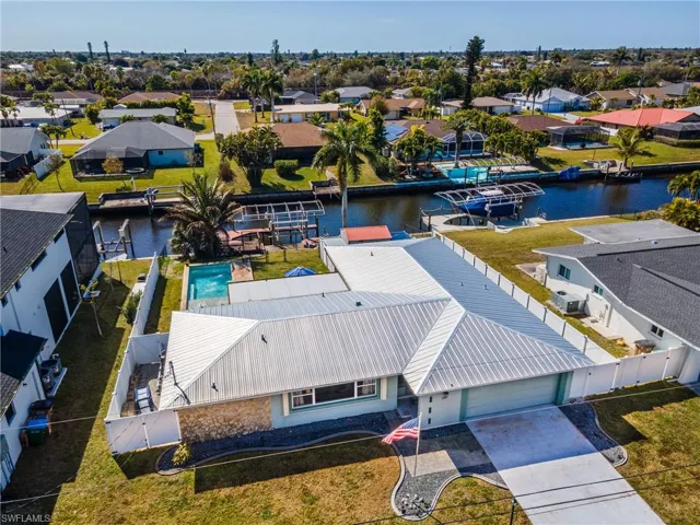 Aerial perspective of suburban area with a nearby body of water