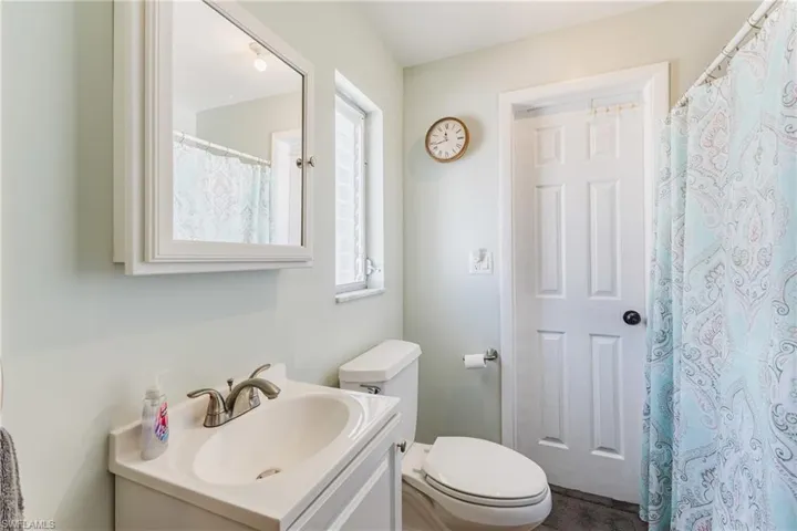 Bathroom with vanity and a shower with curtain