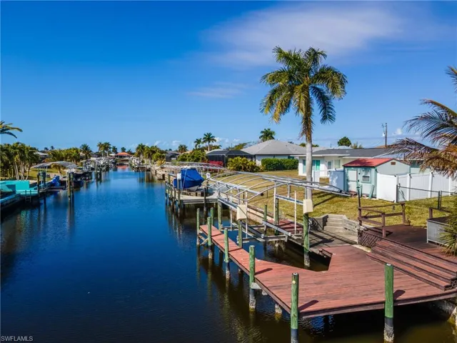 Dock featuring a water view and boat lift