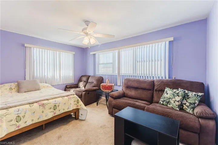 Bedroom with carpet and a ceiling fan