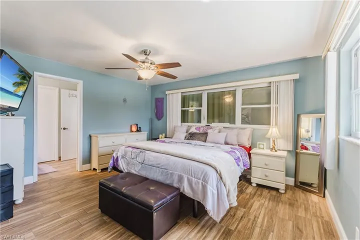 Bedroom featuring wood finished floors and ceiling fan