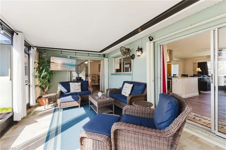Sunroom / solarium with an outdoor hangout area