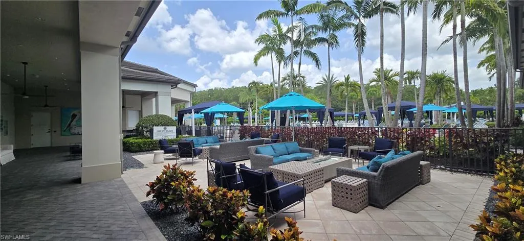 Community Fire Pit with paver patio, multiple seating areas and lush landscaping