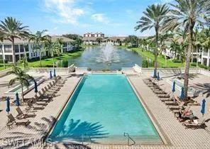 View of pool with a water view