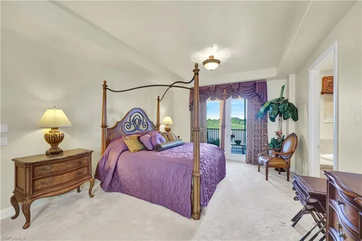 Bedroom with access to exterior and carpet