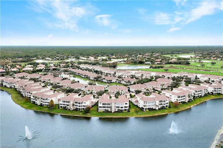 Aerial perspective of suburban area with a large body of water