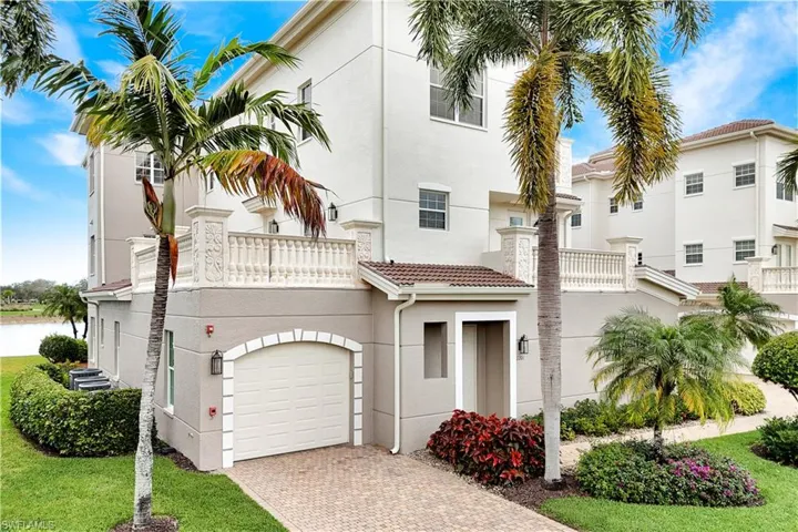 Mediterranean / spanish home with stucco siding, a balcony, decorative driveway, and an attached garage