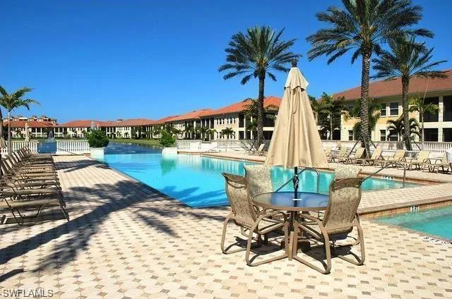 Community pool with a patio area