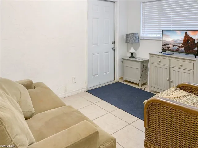 Living room featuring light tile patterned floors