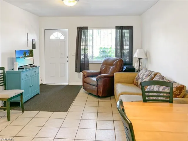 Living room featuring light tile patterned floors