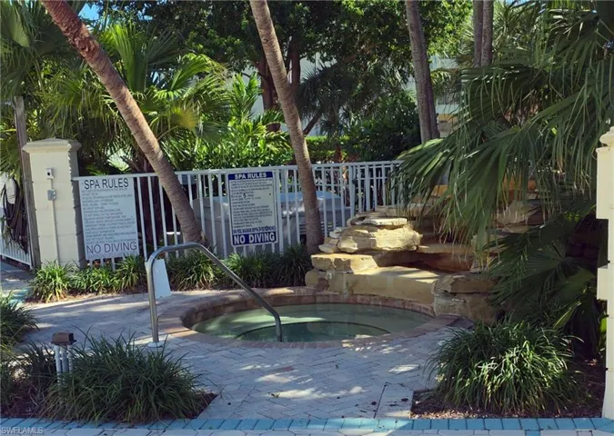 View of pool featuring a hot tub