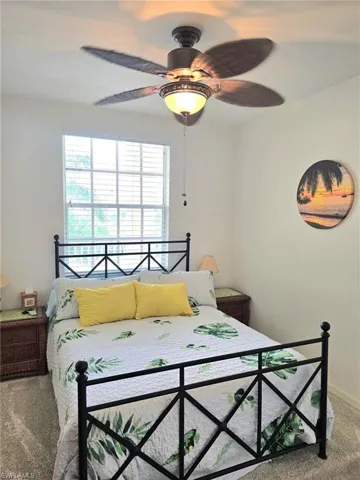 Bedroom with carpet and ceiling fan