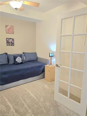 Bedroom with carpet floors and a ceiling fan