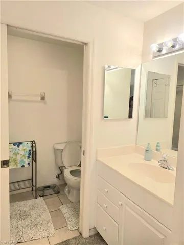 Bathroom with vanity and light tile patterned flooring