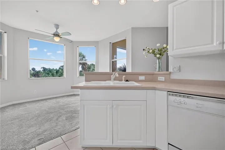Open kitchen to dining with bay windows