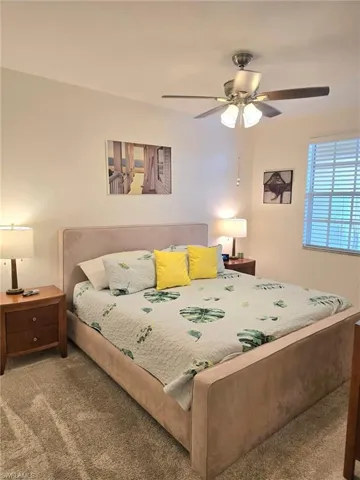 Bedroom with carpet and a ceiling fan