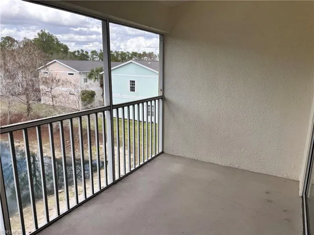 Balcony featuring a sunroom