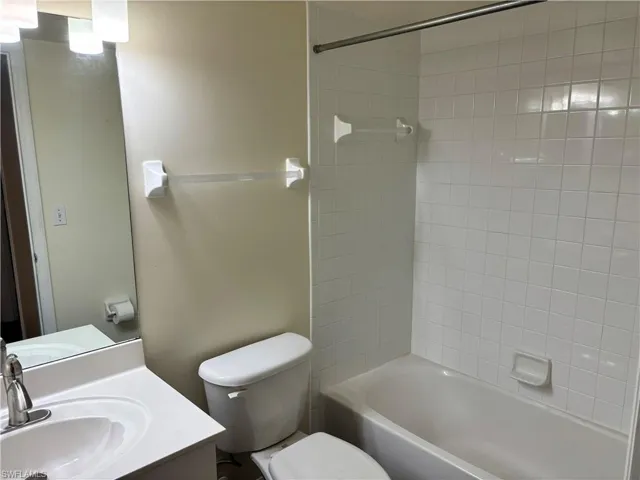 Bathroom with vanity and shower / tub combination