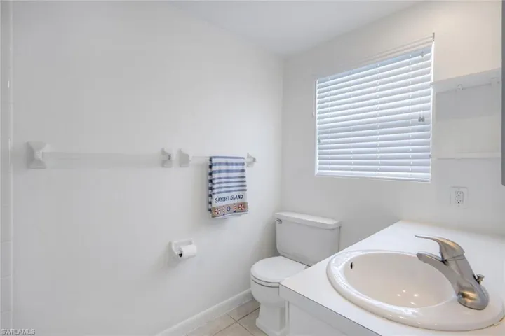 Bathroom with vanity and light tile patterned floors