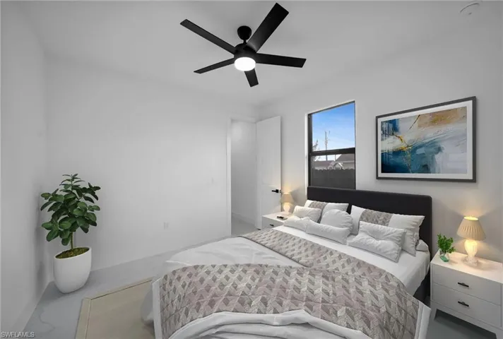 Bedroom featuring baseboards and ceiling fan