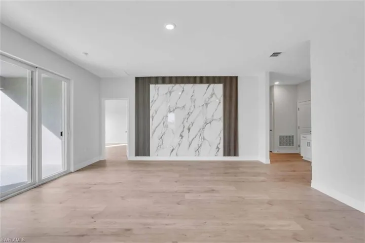 Unfurnished room with recessed lighting and light wood-style flooring