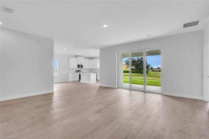 Unfurnished living room featuring recessed lighting and light wood-style flooring