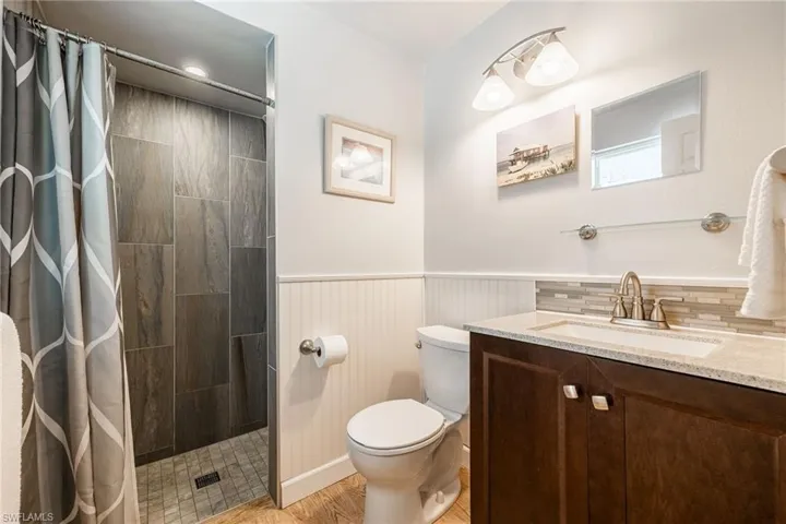 Updated primary bathroom with tiled shower