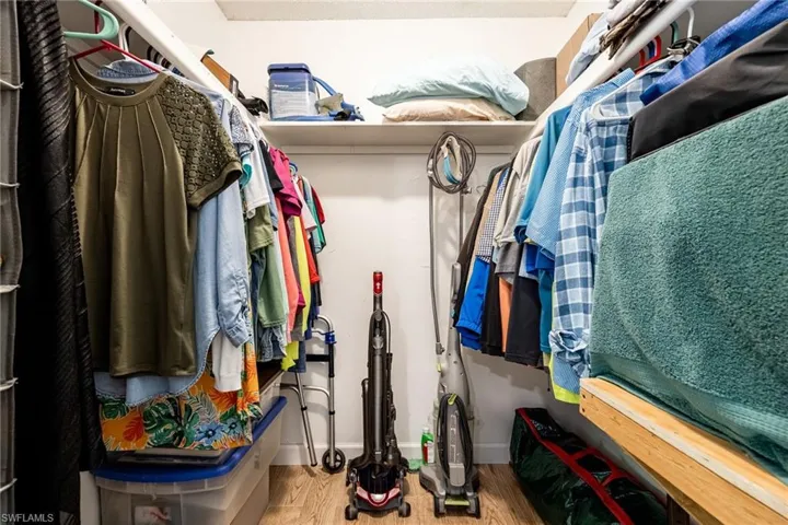 Walk in closet in primary bedroom