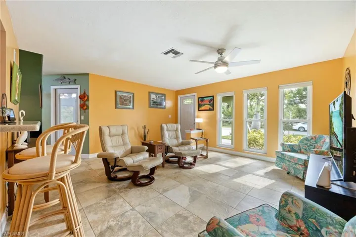 Living room with impact resistant windows to let the sun shine in.