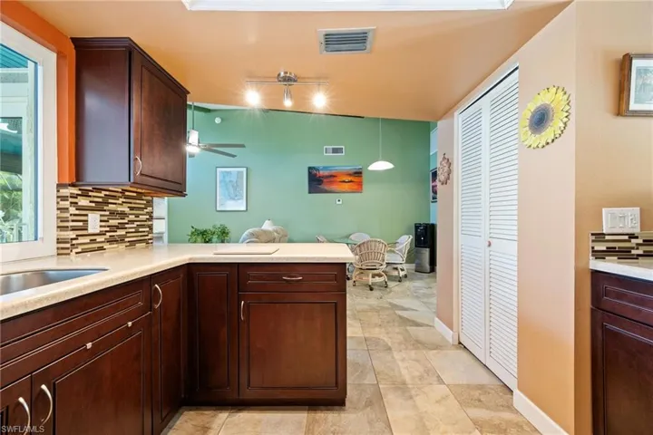 Kitchen with Breakfast Bar overlooking the family room