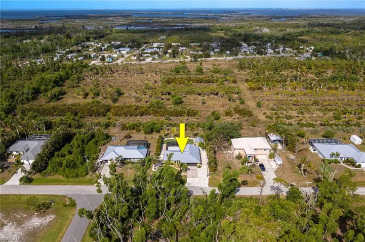 Aerial view of the home that backs up to agricultural land