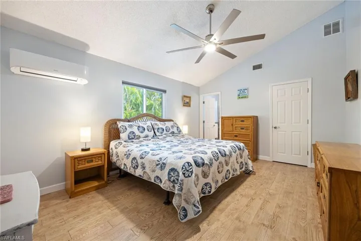 Spacious primary bedroom with mini-split A/C system, walk-in closet & en suite bathroom