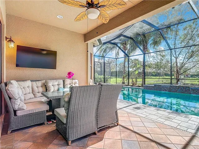 View of patio / terrace featuring ceiling fan, outdoor lounge area, and glass enclosure